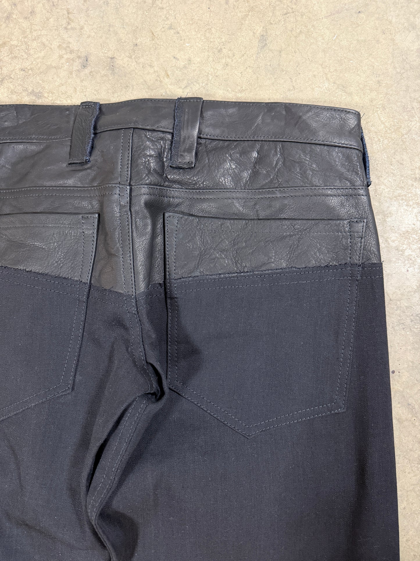 Leather dipped selvedge denim low-waist black